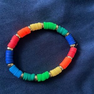 Rainbow clay bead bracelet with stretchy clear string